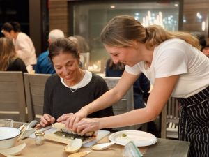 Women making sushi together